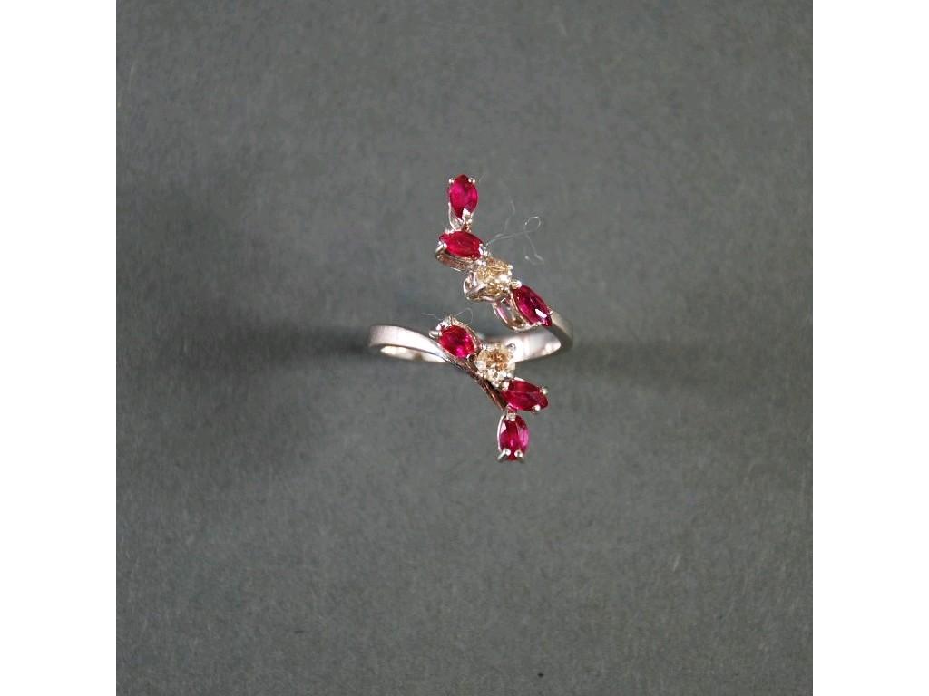 Appraisal: CT WHITE GOLD DIAMOND AND RUBY OPEN CROSS OVER RING