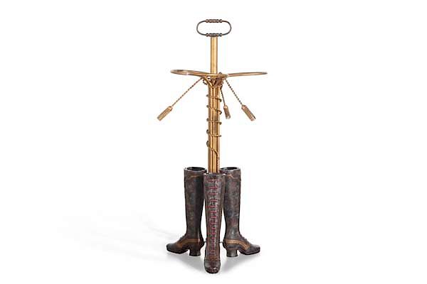 Appraisal: A whimsical addorsed boot form umbrella stand A whimsical addorsed