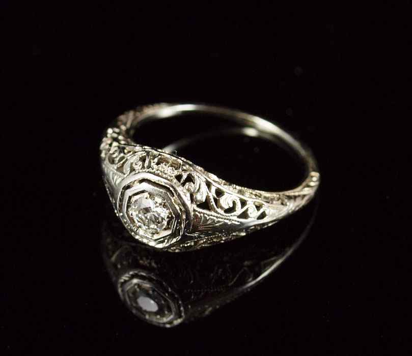 Appraisal: K FILIGREE DIAMOND RING K white gold filigree ring contains