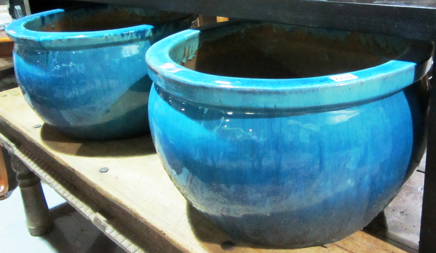 Appraisal: A pair of th century turquoise glaze circular garden pots