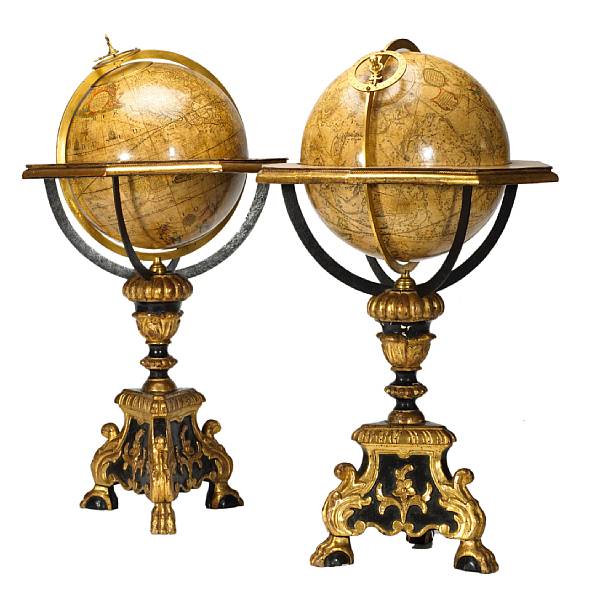 Appraisal: A pair of Louis XIV style table globes on ebonized