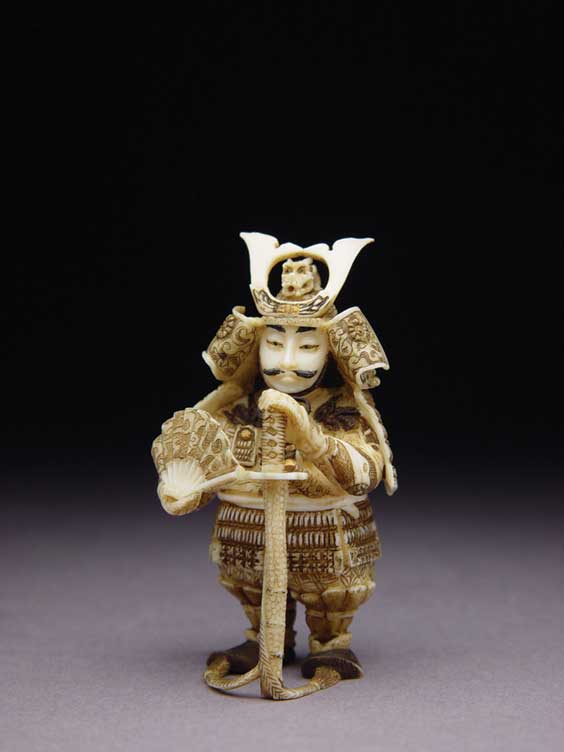 Appraisal: CARVED IVORY NETSUKE Contemporary carved ivory netsuke of a samruai