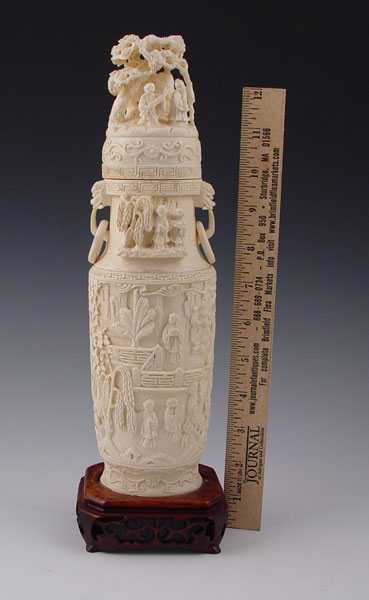 Appraisal: CHINESE CARVED IVORY COVERED VASE Carved from one piece Carved