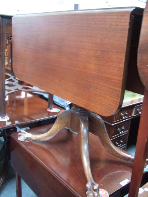 Appraisal: A Regency style mahogany drop flap centre table with a