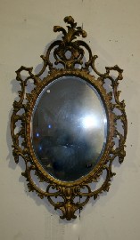 Appraisal: A rococo style gilt framed wall mirror cm high cm