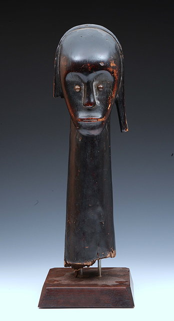 Appraisal: An ethnographic Fang carved wood headon a later pedestal base