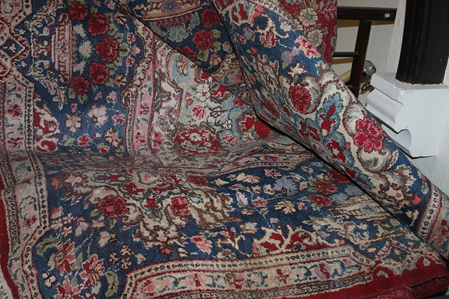 Appraisal: A RED GROUND POSSIBLY MAHAL CARPET with foliate decoration