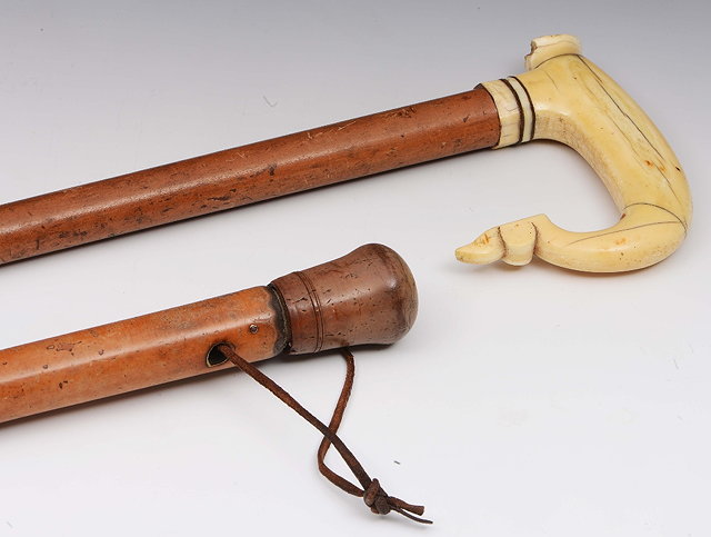 Appraisal: A th Century marine ivory shepherd's crookand a stained ivory