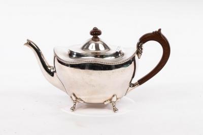 Appraisal: A silver teapot Birmingham of oval form with wavy rim