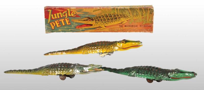 Appraisal: Lot of Tin Litho Alligator Toys Description German and American