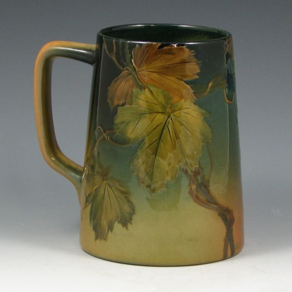 Appraisal: Rookwood Standard Glaze mug with grape vine decoration by Olga