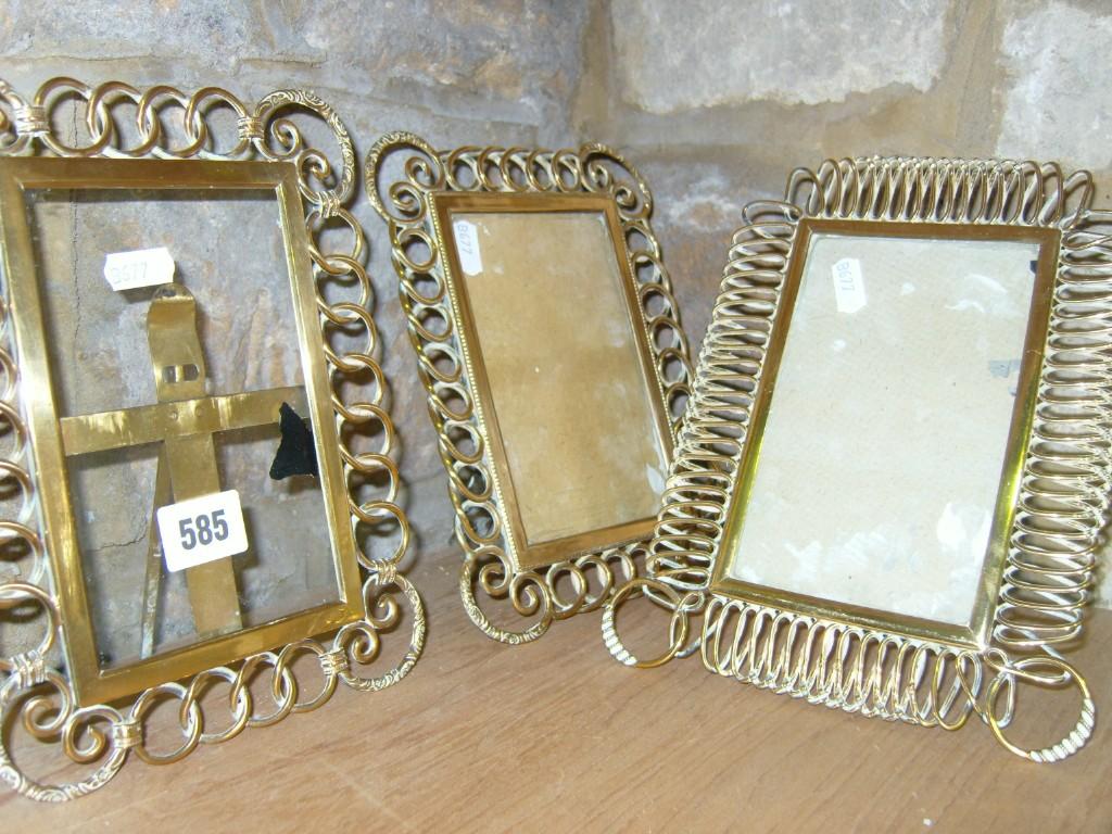 Appraisal: A set of three Victorian brass framed photograph frames with