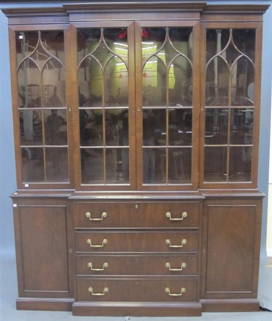 Appraisal: KITTENGER BREAKFRONT A Kittenger George III style mahogany secretary breakfront