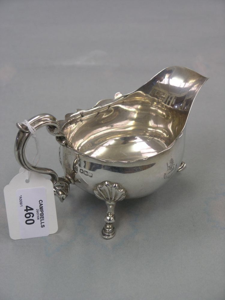 Appraisal: A silver cream jug on cast shell feet double 'S'