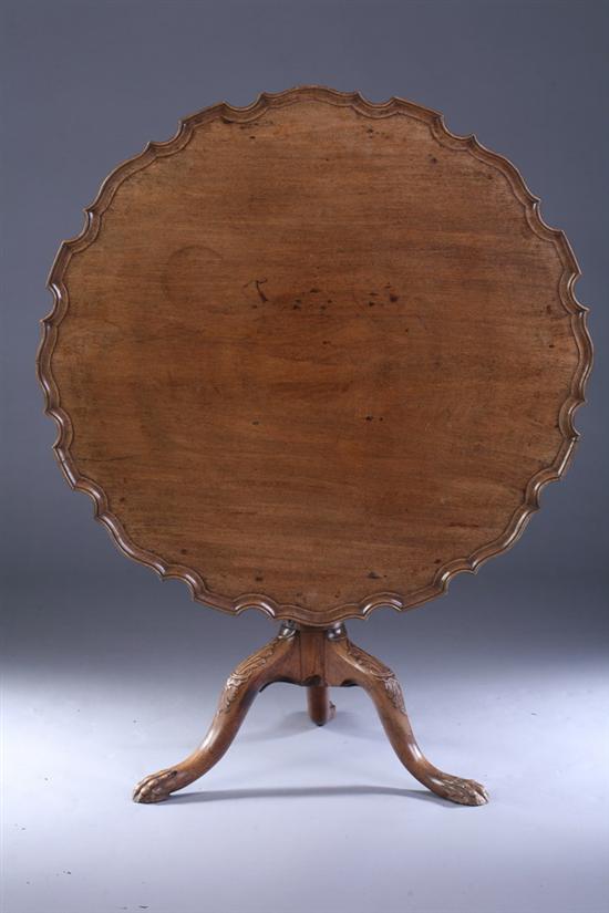 Appraisal: CHIPPENDALE STYLE CARVED WALNUT PIE-CRUST TILT-TOP TEA TABLE th century