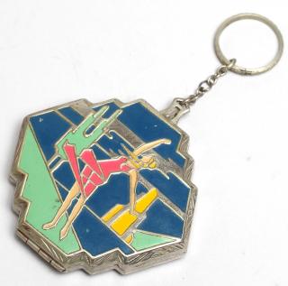 Appraisal: Art Deco Woman's Compact Key Chain Vintage s depicting a