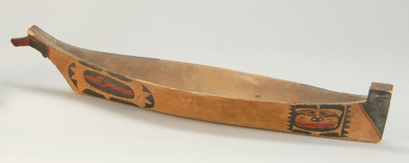 Appraisal: CARVED AND PAINTED HAIDA CANOE th CenturyWith painted totemic decoration