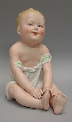 Appraisal: Marked Heubach DEP bisque sitting baby holding one foot Pleasant