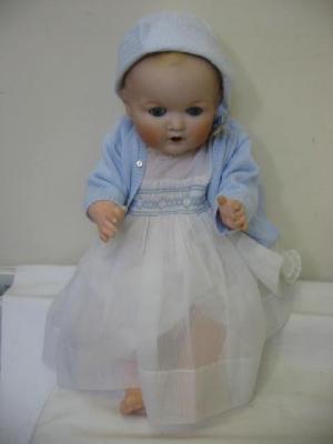 Appraisal: An Armand Marseille bisque head baby doll with blue sleeping