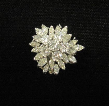 Appraisal: Platinum and diamond claspCluster design displaying central round cut diamond