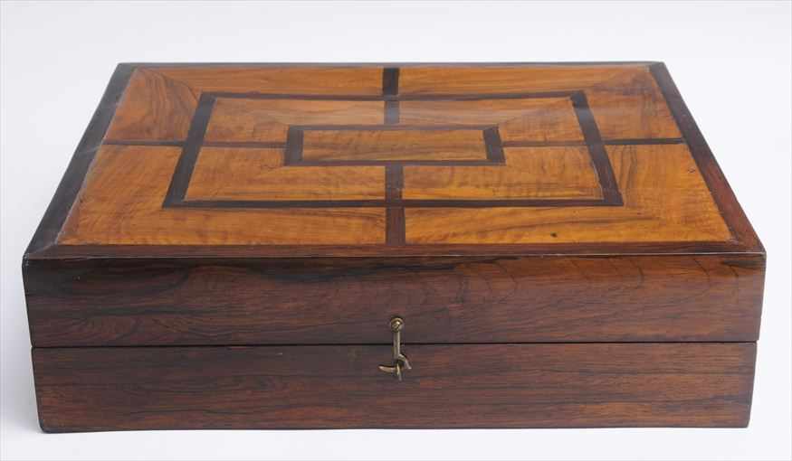 Appraisal: GERMAN BAROQUE WALNUT-INLAID ROSEWOOD GAME BOX The hinged case with