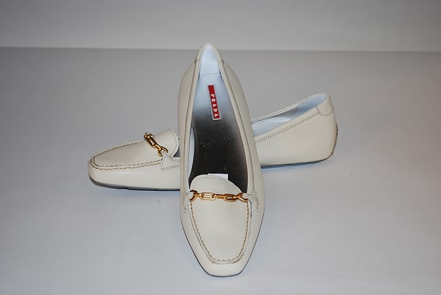 Appraisal: Prada bone calf loafer with signature chain on front Size