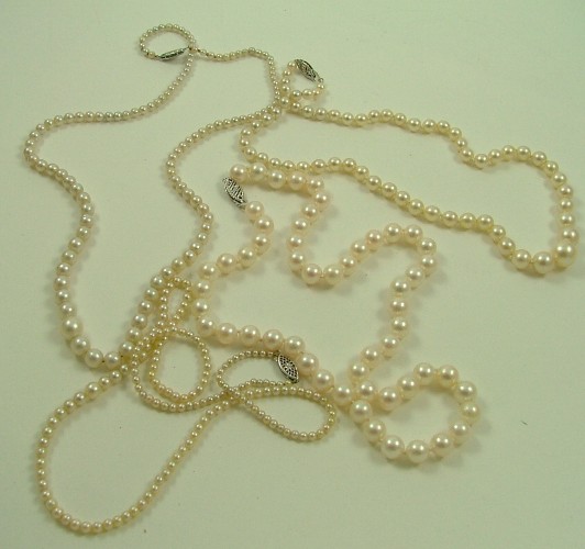 Appraisal: FOUR PEARL AND WHITE GOLD NECKLACES ranging in lengths from