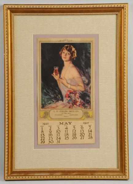 Appraisal: Coca-Cola Calendar Framed under glass displaying a May page Slightly