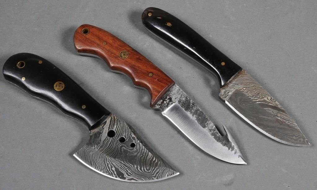 Appraisal: Three handmade custom Damascus steel knives with leather sheaths from