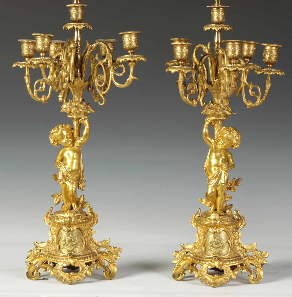 Appraisal: Pair of French Bronze -Arm Candelabras w Cherubs Late th