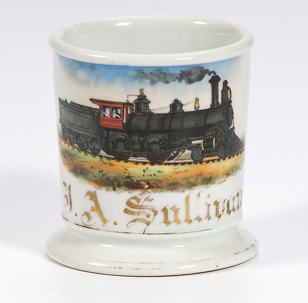 Appraisal: TRAIN SHAVING MUG Porcelain mug with gilding and painted scene