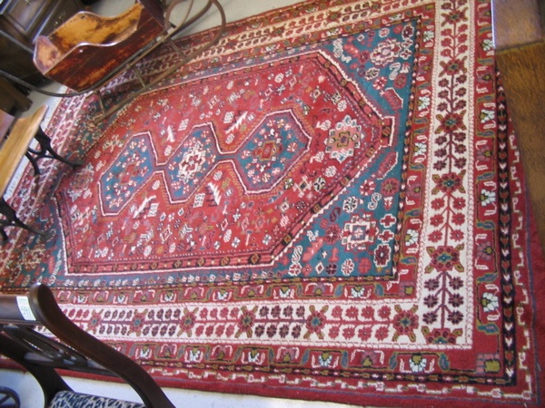 Appraisal: HAND KNOTTED ORIENTAL CARPET Indo-Persian three geometric medallion and stylized