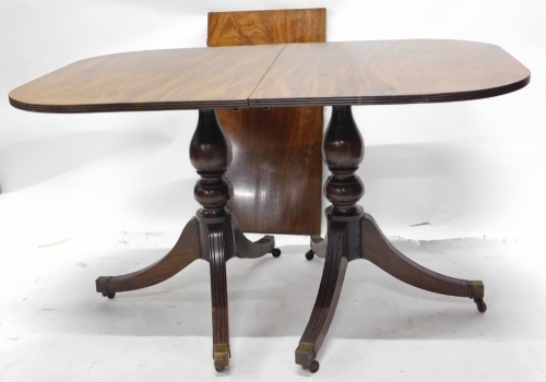 Appraisal: A Regency style mahogany twin pedestal dining table the top