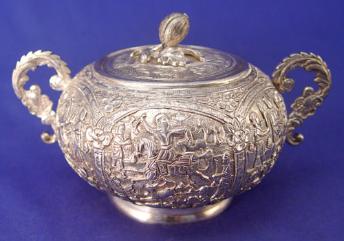 Appraisal: SILVER REPOUSSE COVERED SUGAR WITH MINIATURE TEAPOT AND SUGAR piece