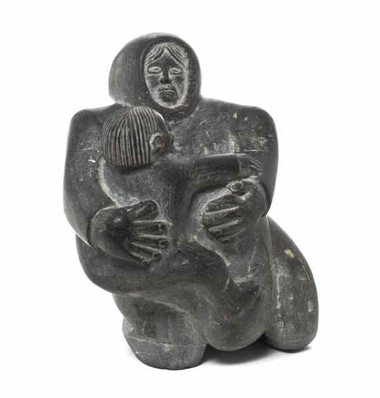 Appraisal: A Stone Inuit Sculpture depicting a mother and child embracing