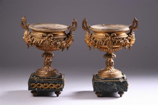 Appraisal: PAIR LOUIS XVI-STYLE ORMOLU URNS late th century Decorated with