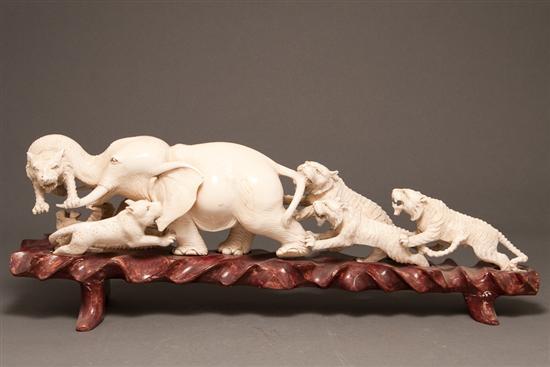 Appraisal: Chinese carved ivory tusk depicting a battle between an elephant