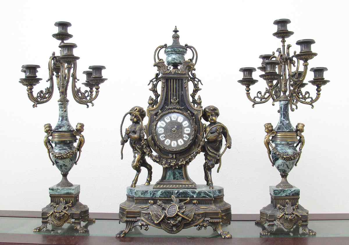 Appraisal: GILT METAL MARBLE FIGURAL CLOCK GARNITURE SET Clock with gilt