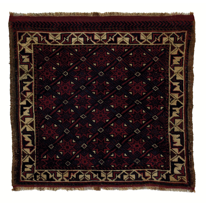 Appraisal: Baluchi rug c floral design on a red field with