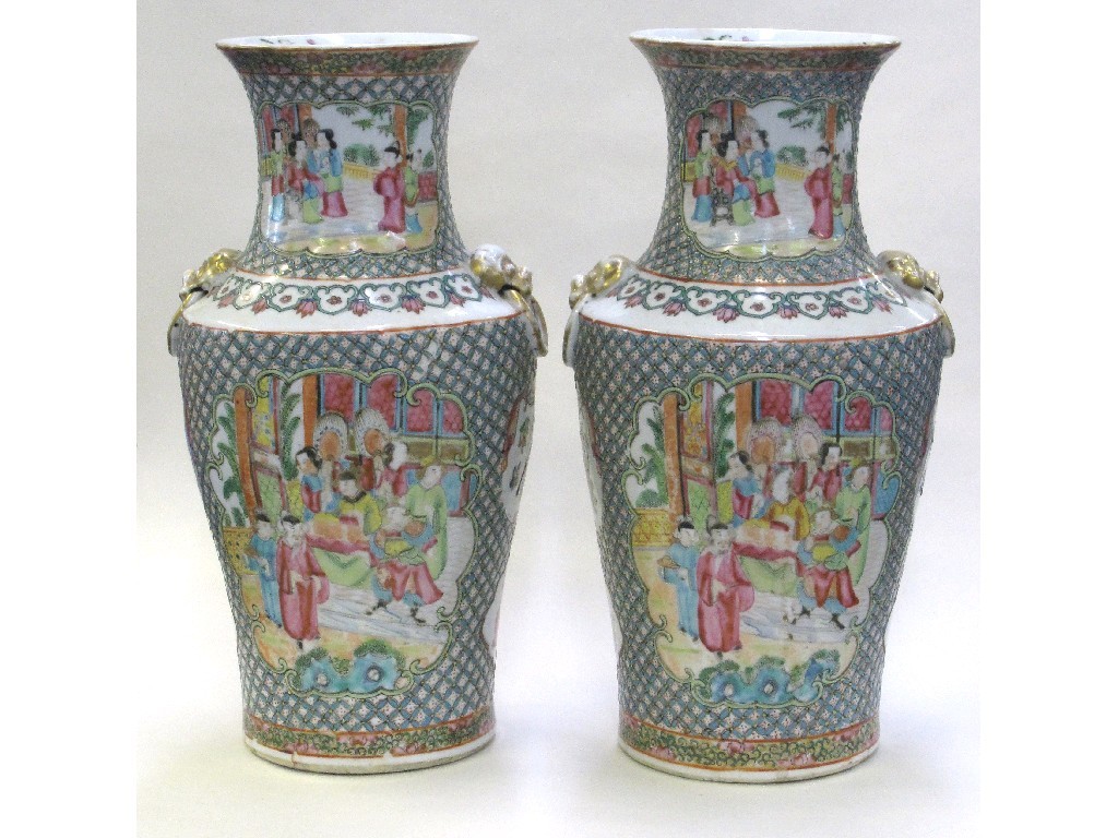 Appraisal: Pair of Famille rose vases painted with scenes with figures