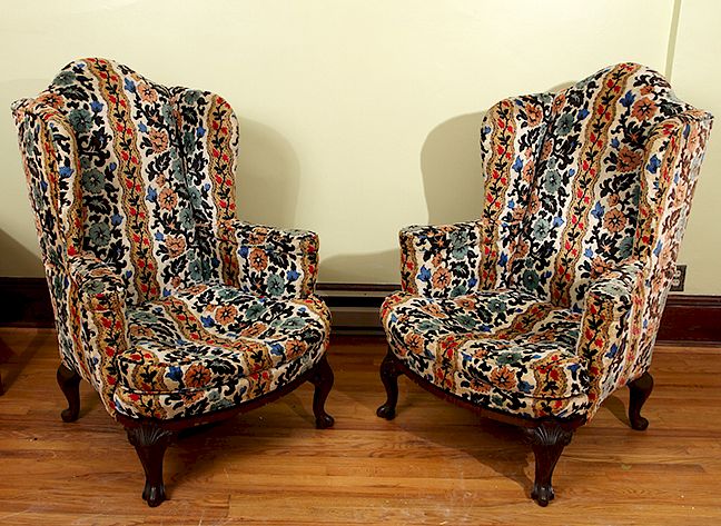 Appraisal: Wing Backed Chairs A pair of late th century comfortable