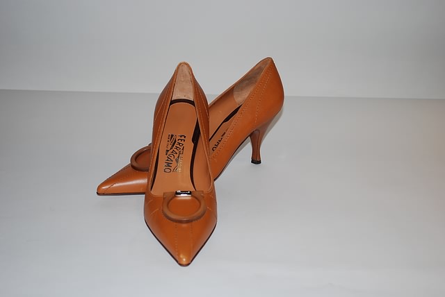 Appraisal: Salvatore Ferragamo camel colored leather pumps with wood horseshoe buckle