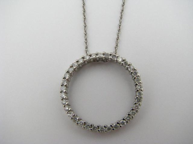 Appraisal: K White Gold circle pendant with diamonds on white gold