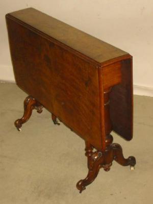 Appraisal: A VICTORIAN WALNUT SUTHERLAND TABLE of rounded oblong form moulded