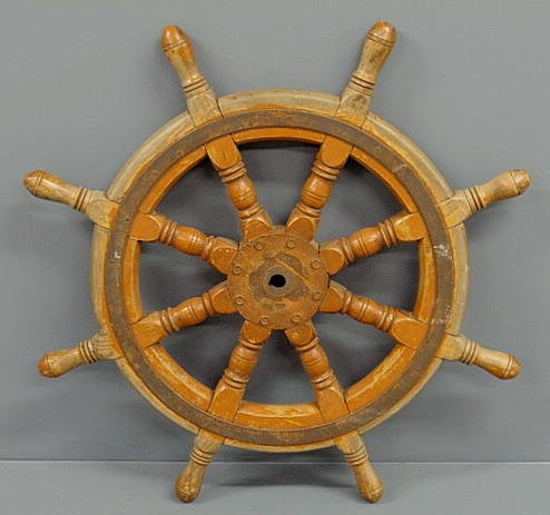 Appraisal: Turned oak ship s wheel with an iron center and