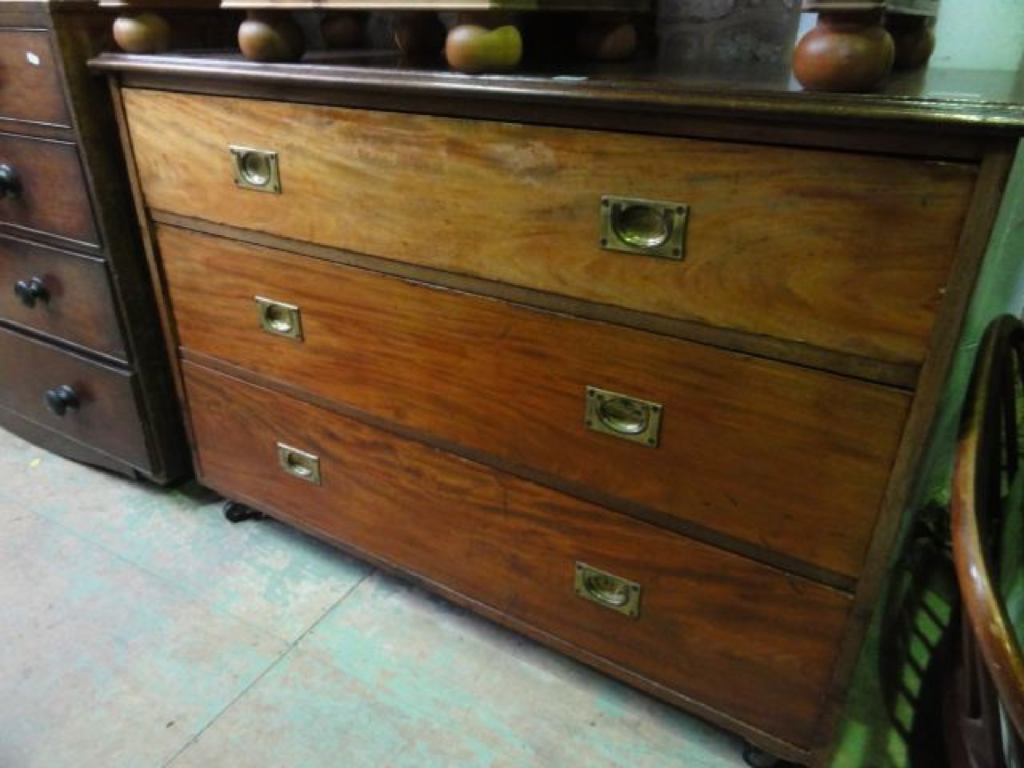 Appraisal: A broad mahogany bedroom chest of three long drawers with