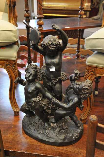 Appraisal: A CAST BRONZE FIGURE DEPICTING CHERUBS