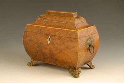 Appraisal: A Regency burr yew sarcophagus shape tea caddy inlaid boxwood