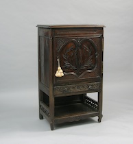 Appraisal: A Dark Carved Oak Cabinet A dark carved oak cabinet