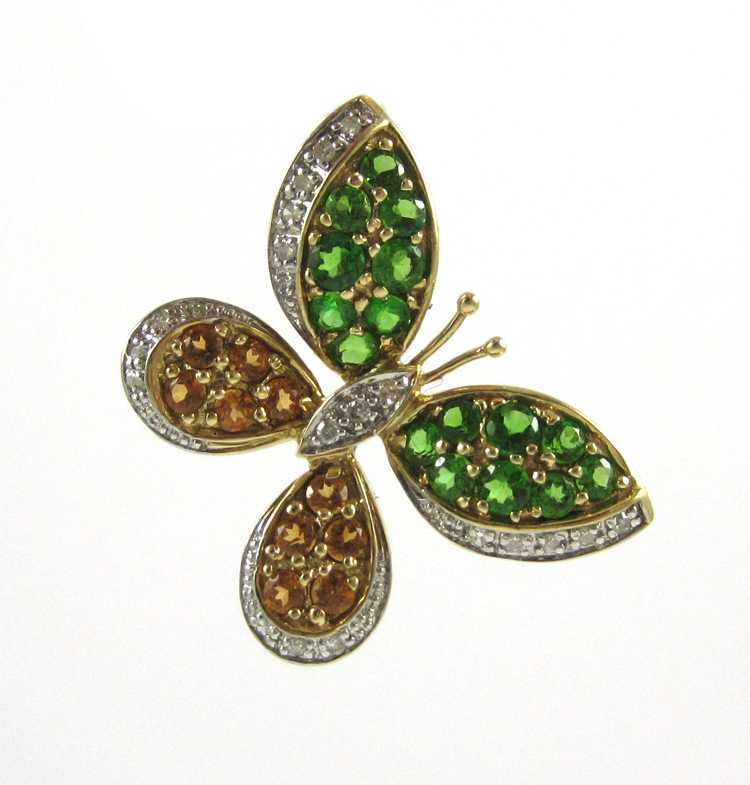 Appraisal: TSAVORITE AND SPESSARTITE BUTTERFLY PENDANT k yellow and white gold